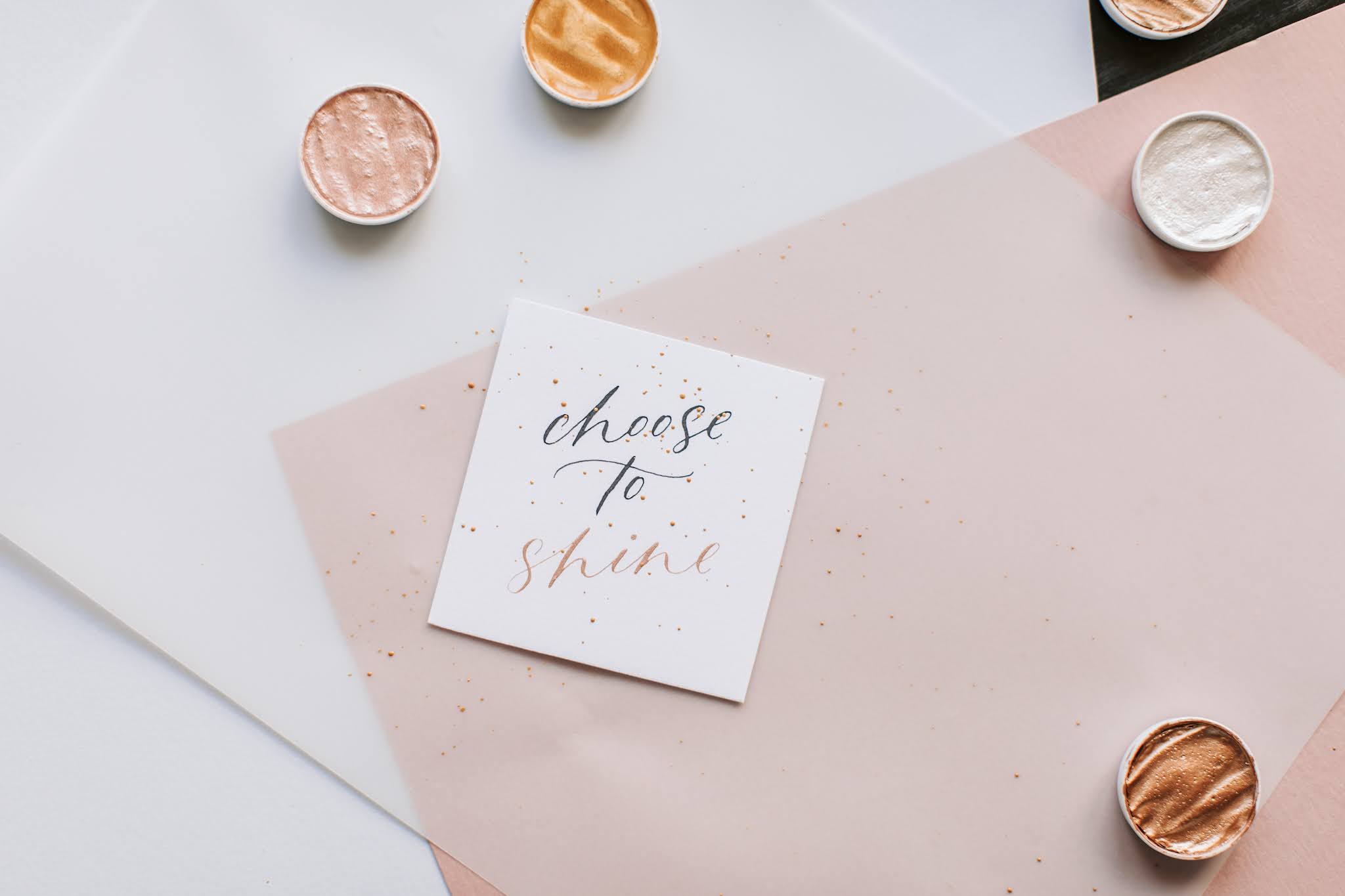 paper with calligraphy saying 'choose to shine'