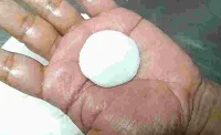 Making rasmalai discs between the palm of hands
