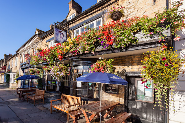 The Angel pub on the church green in Witney Oxfordshire by Martyn Ferry Photography