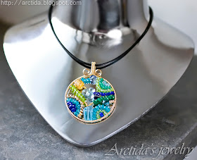 http://www.arctida.com/en/home/109-mosaic-necklace-ooak-apatite-emerald-iolite-lapis-lazuli-peridot-pyrite-and-blue-topaz-necklace-in-14k-gold-filled.html