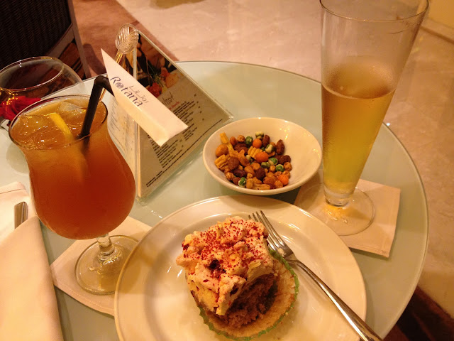 beer, nuts, iced tea and strawberry cupcake in Island Cafe Rotana Hotel Yas Island Abu Dhabi