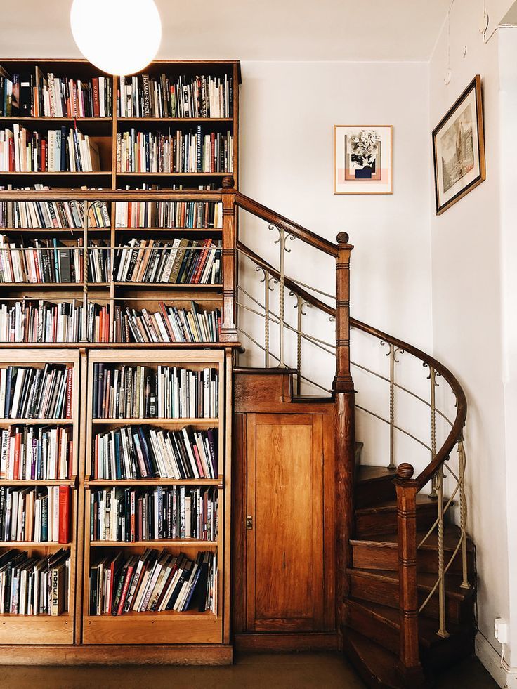 Content in a Cottage Bookcase, Staircase, Home Library Love