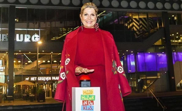 Queen Maxima wore a claret multi embroidered wool cashmere coat from Oscar de la Renta, and a red open-back midi dress from Massimo Dutti