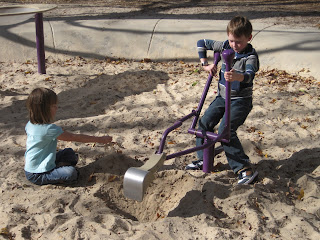 Dash on the digger, Mabel sprinkling sand