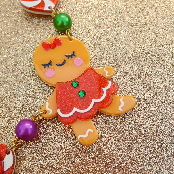 close up of acrylic gingerbread girl on Irregular Choice Christmas necklace
