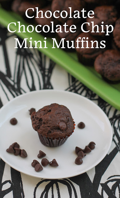 Food Lust People Love: These Chocolate Chocolate Chip Mini Muffins are made from rich chocolate batter with lots of extra chocolate chips. But because they are mini sized, they are perfect as a party snack or buffet table dessert.