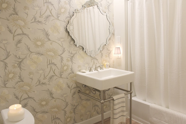 Thibaut wallpaper, DXV bathroom console sink, and Grohe Seabury widespread faucet in a timeless classic bathroom by Hello Lovely Studio. #modernfarmhouse #bathroomdesign #thibaut