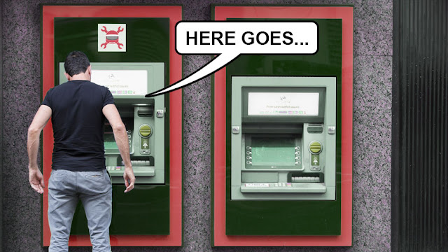 A man standing in front of an ATM saying "here goes"
