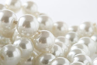 Pearls http://download.dreamstime.com/serveimage.php?imageid=21480387&authcode=1e6e61fcc531d15ed6b53cbd6731cc87&size=6