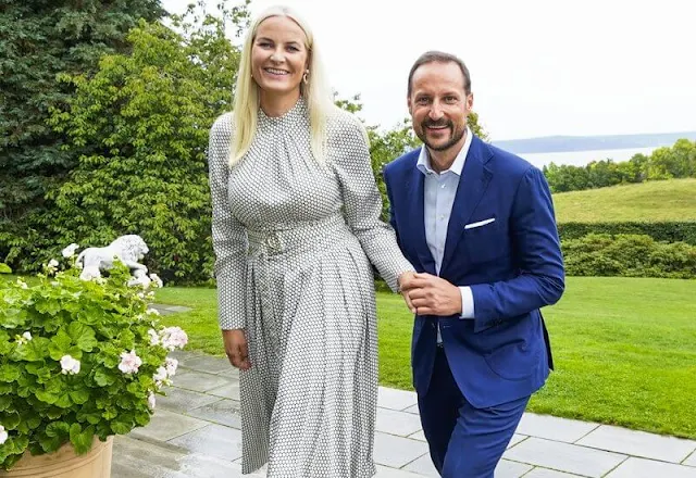 Crown Princess Mette-Marit wore a high neck belted polka-dot silk midi dress by Diane von Furstenberg. Malone Souliers Brenda stripe pumps