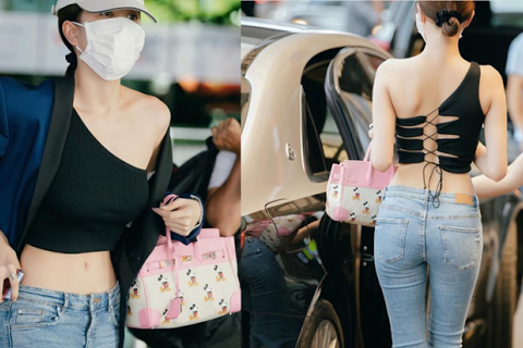 Ngọc Trinh nổi bật tại sân bay với kiểu áo lệch vai chằng chịt dây