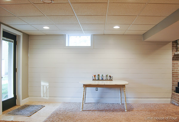 Brighten up your basement with a gorgeous plank wall! Littlehouseoffour.com