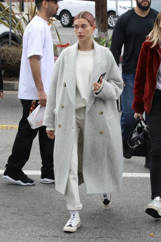 Hailey Bieber Wearing a grey oversize coat