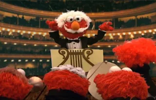 Dorothy imagines Elmo as orchestra chef who conducts and plays in an orchestra. Sesame Street Elmo's World Hands Tickle Me Land
