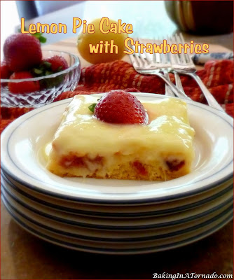 Lemon Pie Cake with Strawberries is a summer celebration. Just 6 ingredients are needed for this lemony cake studded with fresh strawberries. | Recipe developed by www.BakingInATornado.com | #recipe #cake