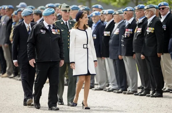 Princess Marie of Denmark participates In Internation Peacekeepers Day at The Citadel. Marie wears Paule Ka White Two-Tone Belted Coat, By Malene Birger Paxlow Pump