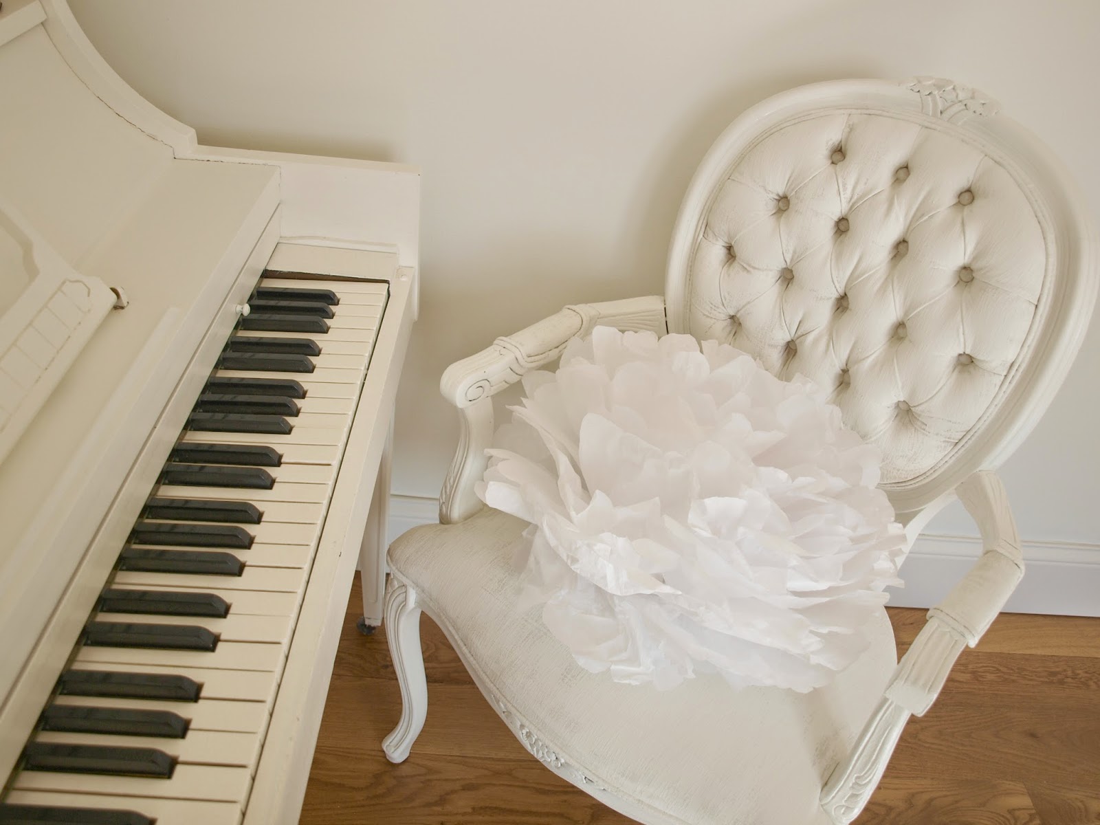 Hello Lovely Studio white piano and French chair with tissue pouf