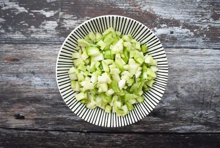 broccoli stalks A bowl of chopped broccoli stalks