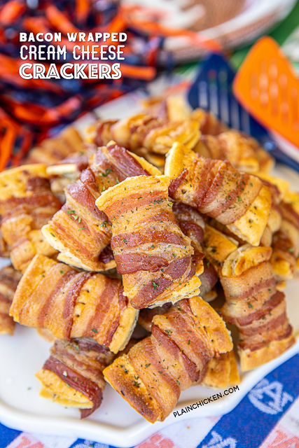 Bacon Wrapped Cream Cheese Crackers - so addictive! These things fly off the plate at parties! Super easy to make with only 3 ingredients! Club crackers, onion and chive cream cheese, and bacon. Can make 10 or 100. Can assemble ahead of time and bake when ready. #superbowl #gameday #bacon #appetizer #bacon #crackers #snacks plate of bacon wrapped crackers
