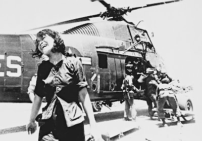 Tim Page’s world-renowned photograph of the Vietnam War showing a grieving widow as her husband’s body is carried off a chopper.