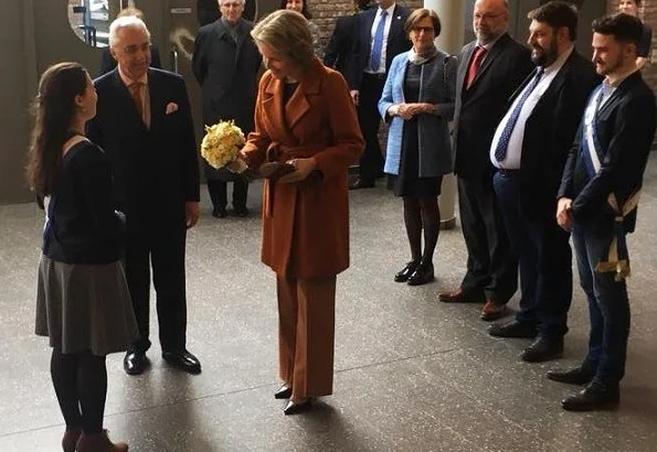 Queen Mathilde of Belgium visited the Luca School of Arts in Leuven. Queen wore Natan blouse and Natan trousers. Mathilde wore Natan coat, and earrings