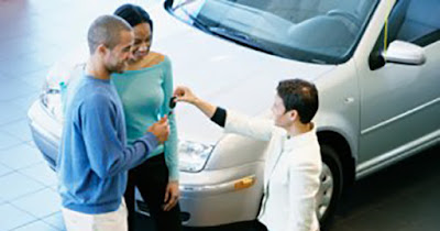 African American family receiving a car