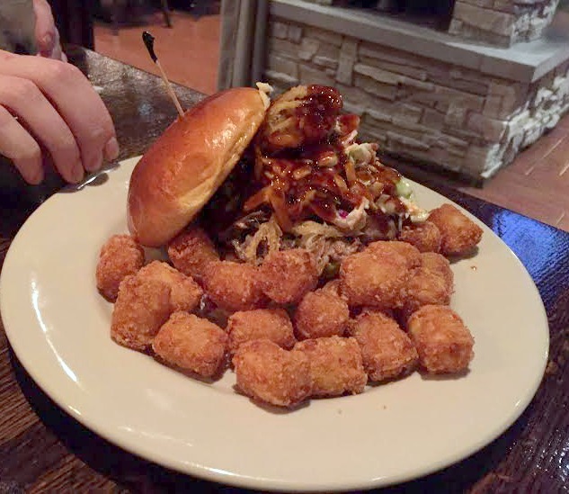 BBQ pulled pork sandwich with tater tots