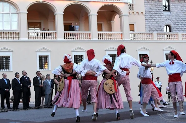 Princess Charlene and Prince Albert of Monaco watched the traditional celebrations of St. John's Day procession (Fête de la Saint-Jean) at Palace Square in Monaco