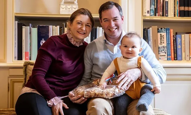 Prince Guillaume, Princess Stephanie and Prince Charles. Boden and Jacadi Paris. Burgundy sweater and gold earrings