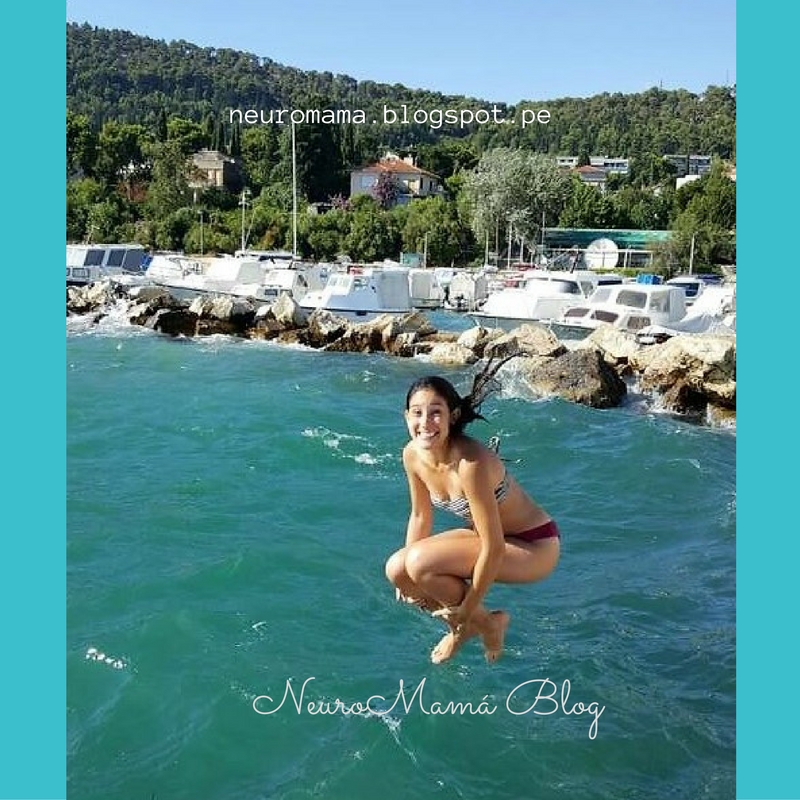 Happy Woman jumping into the ocean