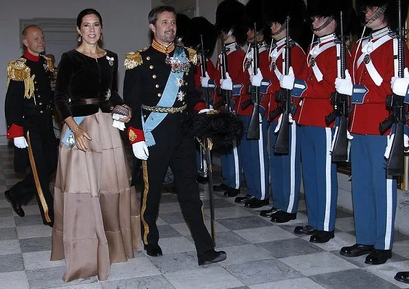 Crown Prince Frederik and Crown Princess Mary attended New Year reception. Princess Mary wore satin skirt