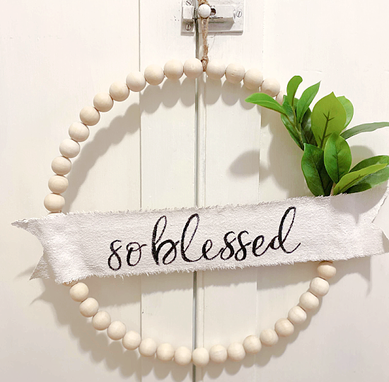 so blessed beaded banner wreath with greens