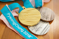 Photograph showing Gold, Silver and Bronze Olympic medals from 2018 games