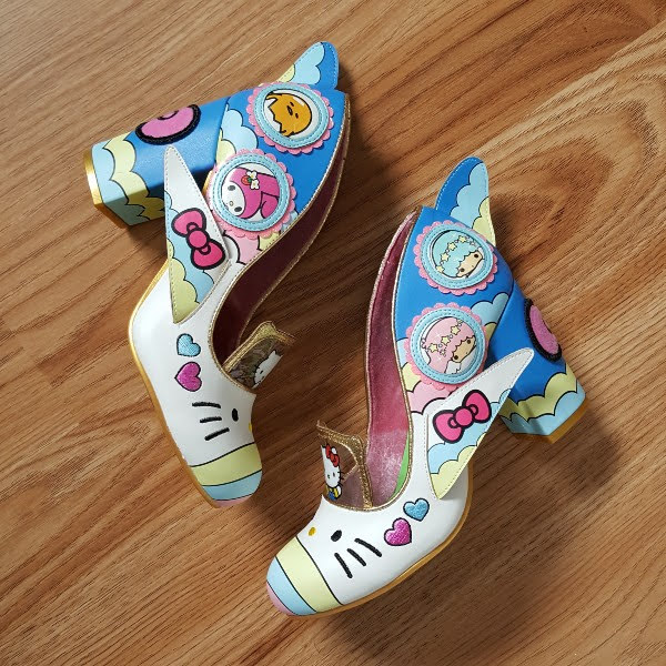 side view of Hello Kitty court shoes on floor