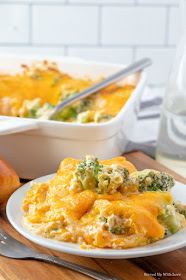 Cheese Broccoli Casserole recipe on white plate with silver fork