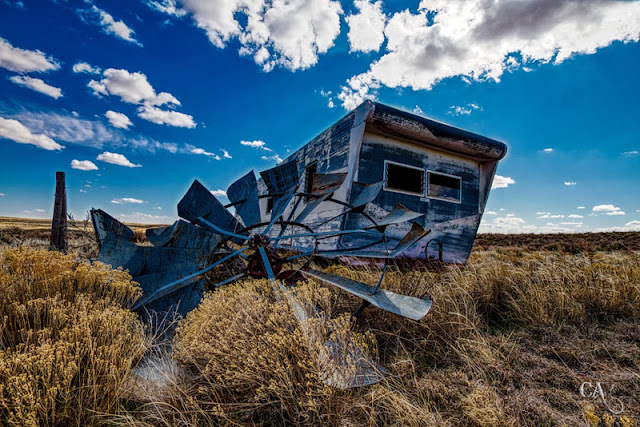 trailer home and defunct windmill