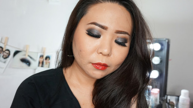 Sultry smokey look with Urban Decay Naked One palette in the color of gunmetal, creepy, buck and virgin. Combined with a red natural lip gloss from Bourjois Rouge Edition Aqua Laque in 04. A good combination for a bridal look for dinner reception. If you are looking for a make up artist in Jakarta, kindly contact me.