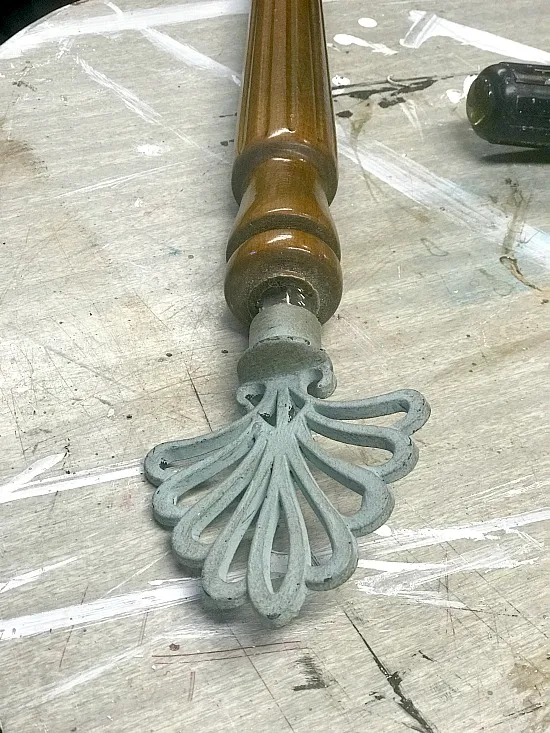 spindle with metal flourish