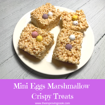 Mini Eggs Marshmallow Crispy Treats on a white plate viewed from above