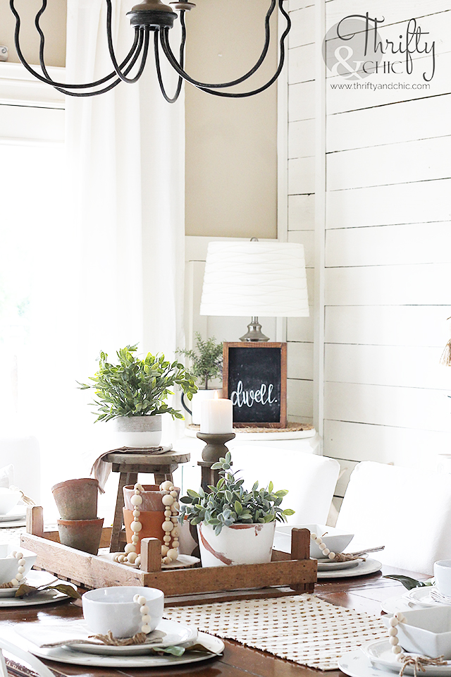 Summer dining room decor and decorating ideas. Farmhouse dining room decor. Farmhouse tablescape decor. DIY place setting ideas. Dining room buffet ideas. Farmhouse chandelier. Wood and metal chandelier. Dining room wall decor. Wood and white dining room decor.