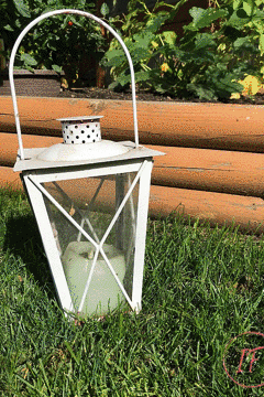 A recycled metal candle lantern for Halloween. Budget-friendly spooktacular halloween lighting from stuff in your decoration bin and the dollar store.