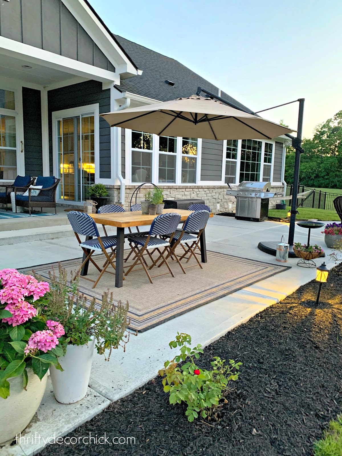 Outdoor patio with eating and fire pit areas