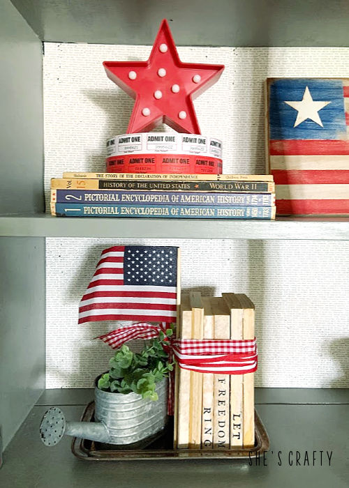 Last minute 4th of july decorating ideas -gray cabinet shelves vignette- patriotic books, stars, flag, stamped books