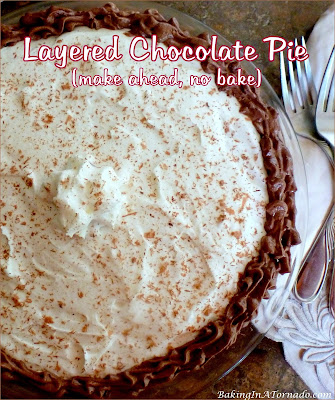Layered Chocolate Pie is a no bake dessert. Layers of chocolate and white chocolate pudding are assembled with flavored whipped cream. Make ahead and no bake! | Recipe developed by www.BakingInATornado.com | #recipe #dessert