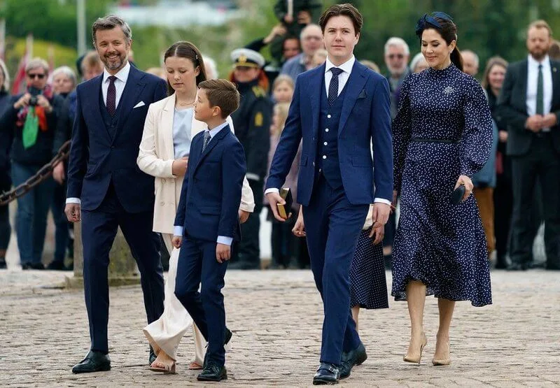 Crown Princess Mary wore IRIS & INK Alison polka-dot satin midi dress. Princess Isabella wore an ivory blazer suit from MaxMara