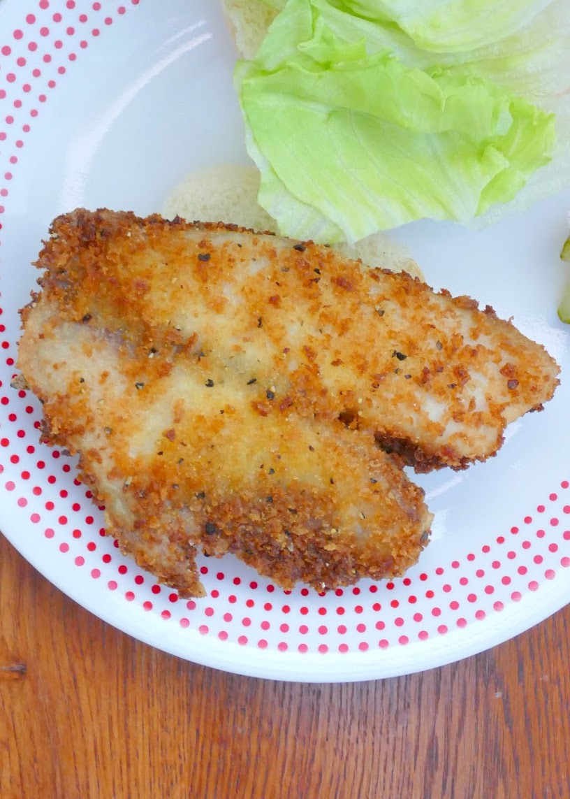 Need an easy dinner? This recipe is for you! Crispy, golden fried fish fillets on a bun with your favorite toppings! So good! Use tilapia or any white fish for this sandwich!