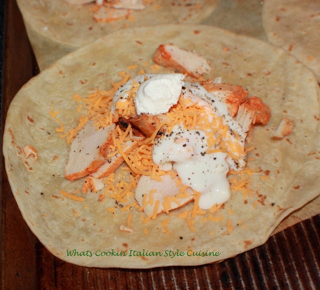 These are flour tortilla filled with buffalo chicken filling, blue cheese dressing, shredded cheddar cheese