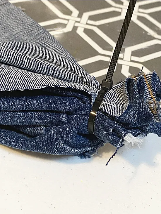 zip tie gather of blue jean