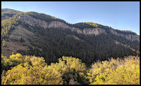 View of a beautiful cliff line called the China Wall across Logan Canyon from the Wind Caves Trail