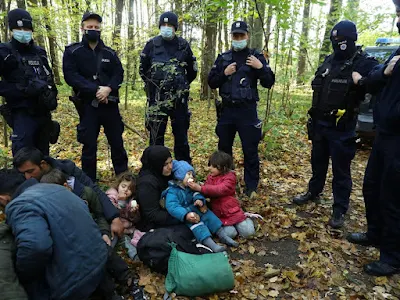 migrants at Belarus border with Poland
